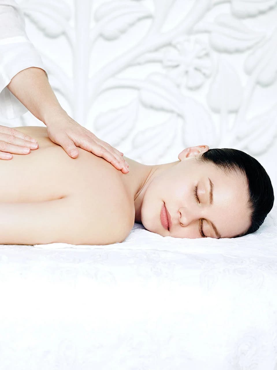 Guest receiving a shoulder massage at a spa.